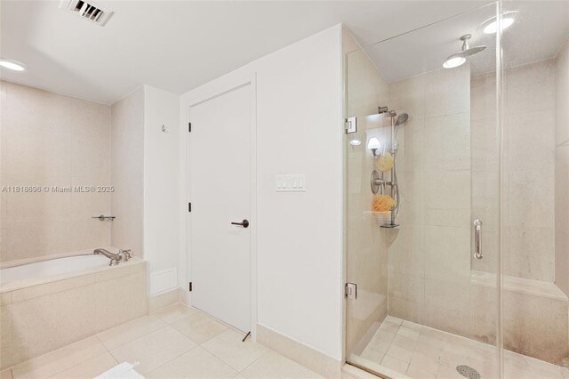 6801 Collins Ave Unit 1401, Door Number Miami Beach, FL 33141 - full bath with a stall shower, a bath, tile patterned flooring, and recessed lighting