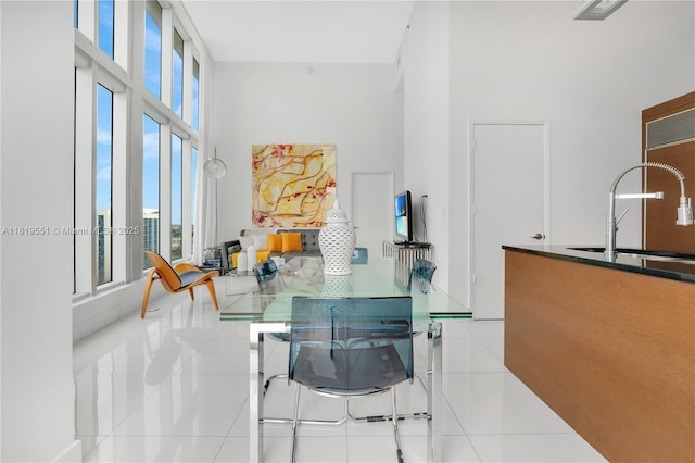 485 Brickell Ave Unit 4004, Miami, FL 33131 - dining room with tile patterned floors and a high ceiling