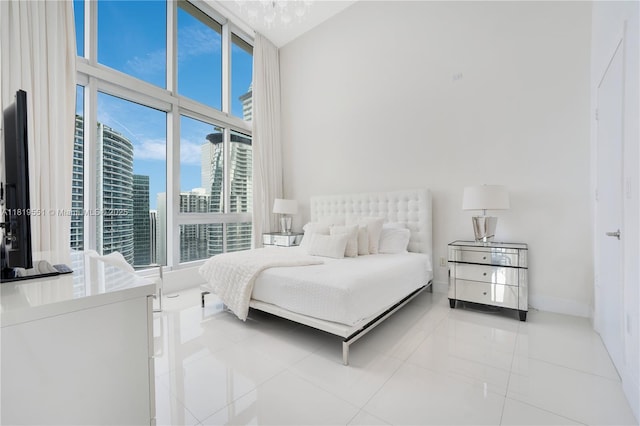 485 Brickell Ave Unit 4004, Miami, FL 33131 - tiled bedroom featuring a towering ceiling and a view of city