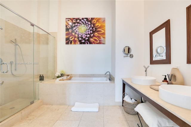 485 Brickell Ave Unit 4004, Miami, FL 33131 - full bathroom featuring a garden tub, a shower stall, double vanity, and tile patterned flooring