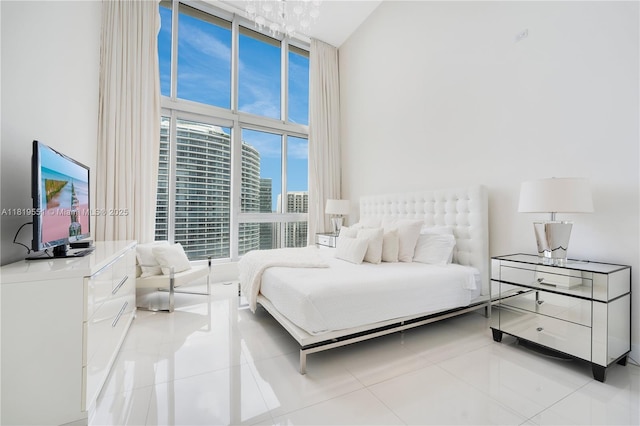 485 Brickell Ave Unit 4004, Miami, FL 33131 - tiled bedroom with a towering ceiling