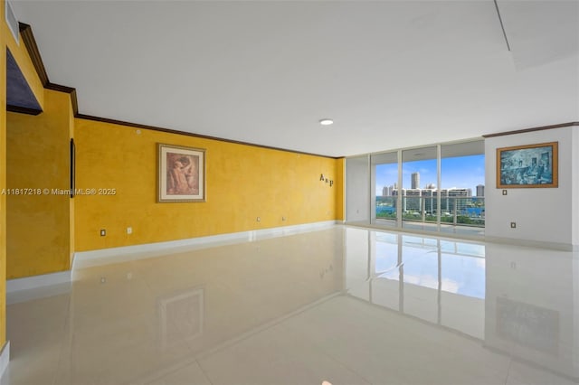 3201 NE 183rd St Unit 1702, Aventura, FL 33160 - tiled empty room featuring expansive windows, recessed lighting, and a city view