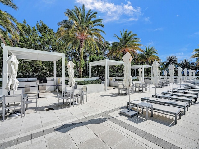 3201 NE 183rd St Unit 1702, Aventura, FL 33160 - view of patio with a pergola and outdoor lounge area