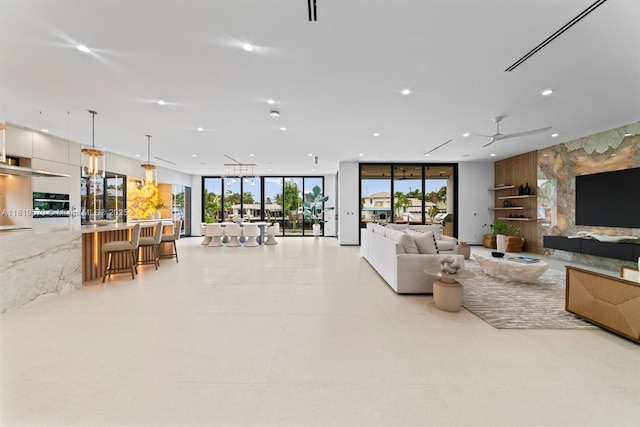 2033 NE 22nd St, Wilton Manors, FL 33305 - living area with recessed lighting, ceiling fan, and a wall of windows