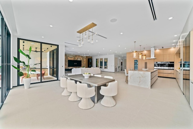 2033 NE 22nd St, Wilton Manors, FL 33305 - dining area with floor to ceiling windows, recessed lighting, a chandelier, and light tile patterned floors