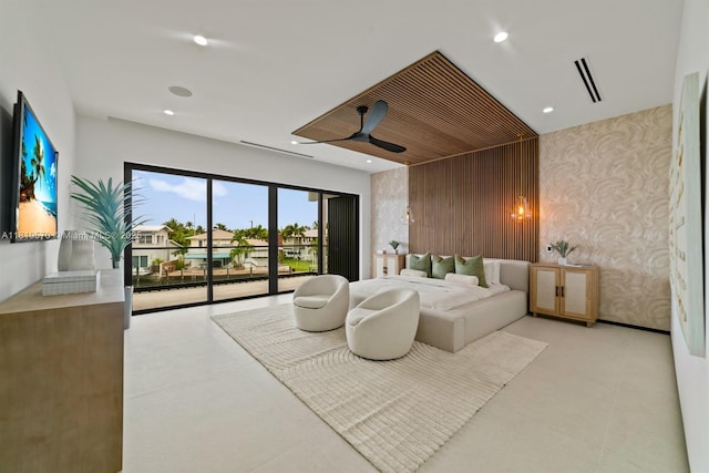 2033 NE 22nd St, Wilton Manors, FL 33305 - bedroom featuring access to exterior, wallpapered walls, recessed lighting, and an accent wall