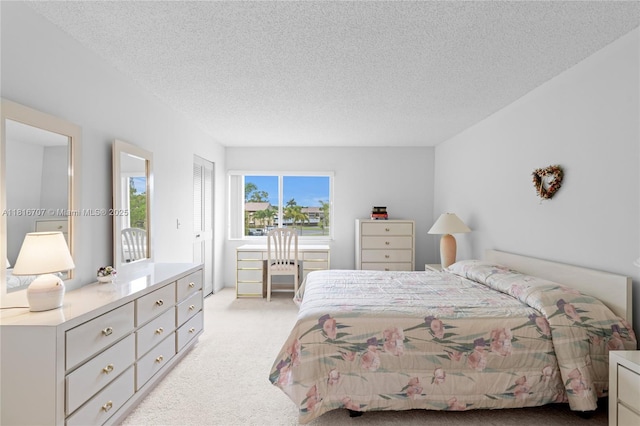311 Pine Ridge Cir Unit C-2, Green Acres, FL 33463 - bedroom with light carpet and a textured ceiling