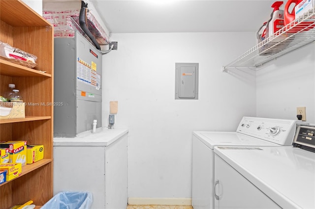 311 Pine Ridge Cir Unit C-2, Green Acres, FL 33463 - washroom featuring electric panel and washing machine and clothes dryer