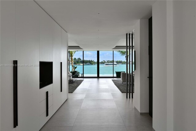 375 N Hibiscus Dr, Miami Beach, FL 33139 - hall featuring a wall of windows and a water view