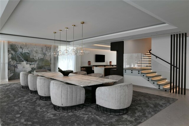 375 N Hibiscus Dr, Miami Beach, FL 33139 - dining area featuring stairway and a tray ceiling
