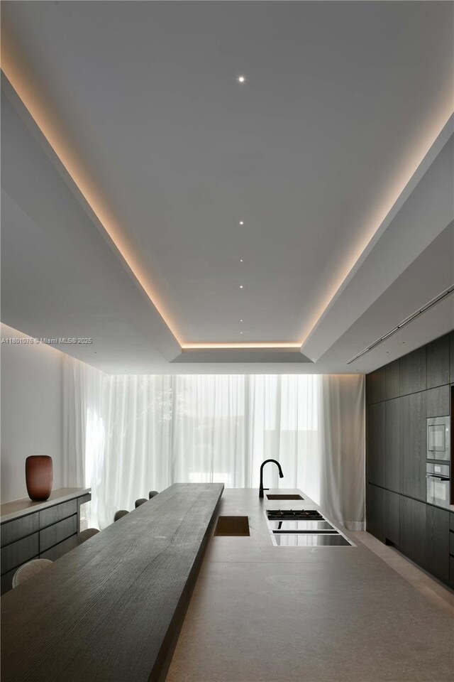 375 N Hibiscus Dr, Miami Beach, FL 33139 - interior space with a tray ceiling and carpet