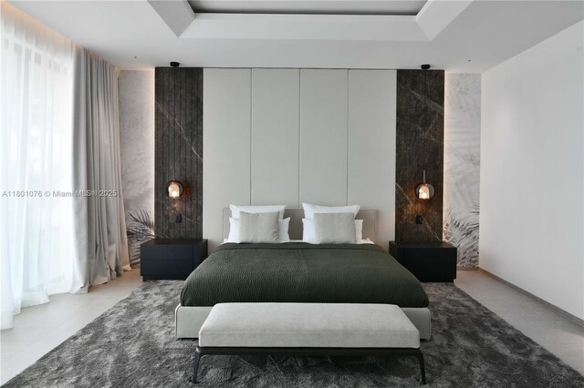 375 N Hibiscus Dr, Miami Beach, FL 33139 - bedroom featuring a raised ceiling
