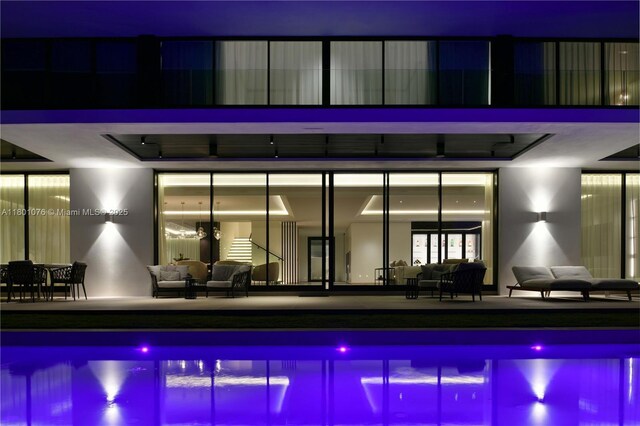 375 N Hibiscus Dr, Miami Beach, FL 33139 - pool at night with an outdoor pool, outdoor lounge area, and a patio