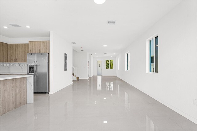 19446 SW 296th St Unit A, Homestead, FL 33030 - unfurnished living room featuring light tile patterned floors, recessed lighting, and baseboards