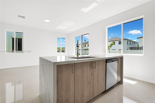 19446 SW 296th St Unit A, Homestead, FL 33030 - kitchen with modern cabinets, a sink, dishwasher, an island with sink, and light countertops