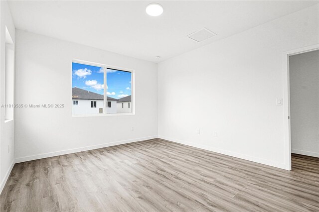 19446 SW 296th St Unit A, Homestead, FL 33030 - unfurnished room featuring wood finished floors and baseboards