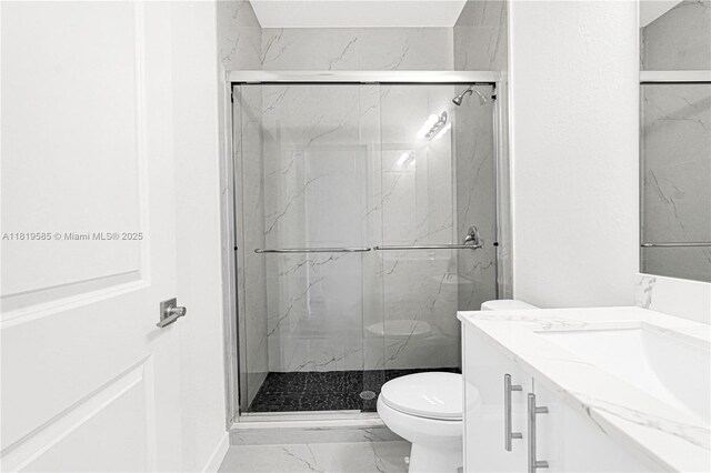19446 SW 296th St Unit A, Homestead, FL 33030 - bathroom with marble finish flooring, vanity, toilet, and a marble finish shower