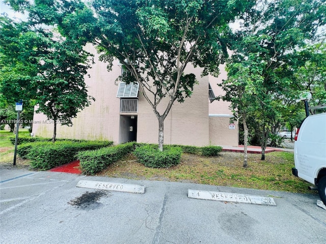 8511 NW 8th St Unit 103, Miami, FL 33126 - view of building exterior featuring uncovered parking