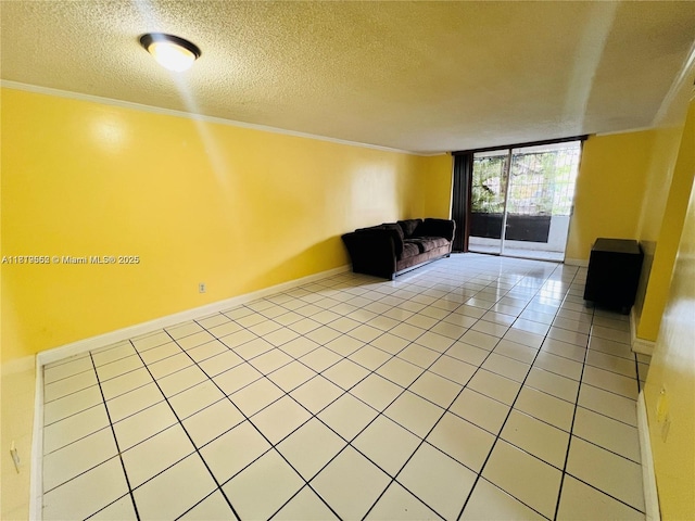 8511 NW 8th St Unit 103, Miami, FL 33126 - unfurnished living room with crown molding, light tile patterned floors, baseboards, and a textured ceiling