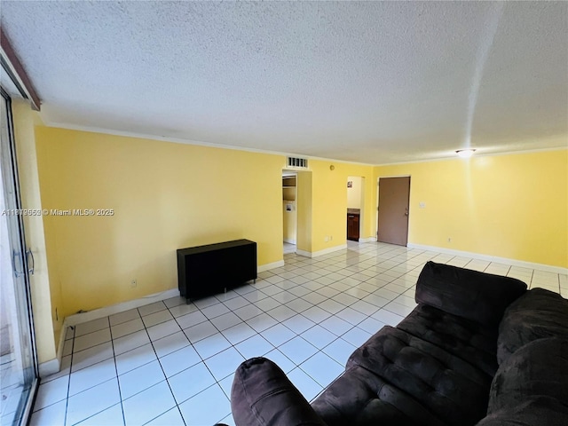 8511 NW 8th St Unit 103, Miami, FL 33126 - living area with a textured ceiling, light tile patterned floors, and baseboards
