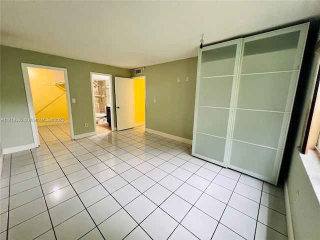 8511 NW 8th St Unit 103, Miami, FL 33126 - empty room featuring baseboards and light tile patterned floors