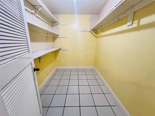 8511 NW 8th St Unit 103, Miami, FL 33126 - spacious closet featuring light tile patterned floors