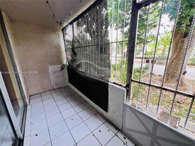 8511 NW 8th St Unit 103, Miami, FL 33126 - unfurnished sunroom with healthy amount of natural light