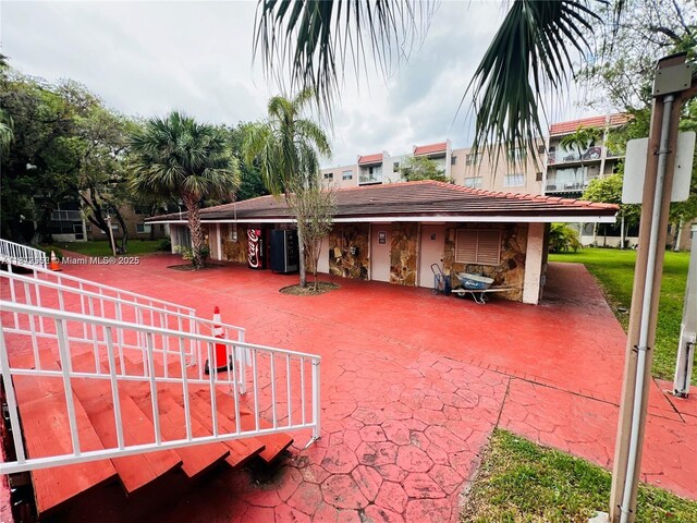 8511 NW 8th St Unit 103, Miami, FL 33126 - exterior space featuring stucco siding and stone siding