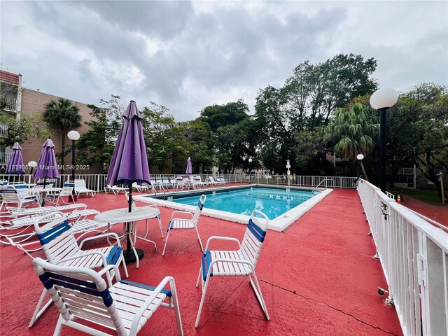 8511 NW 8th St Unit 103, Miami, FL 33126 - community pool featuring a patio