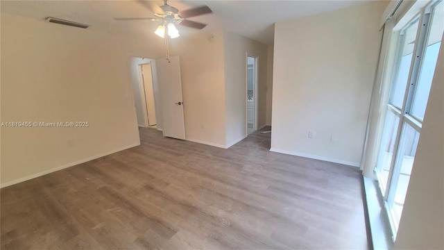 3321 Raleigh St Unit 3H, Hollywood, FL 33021 - empty room featuring ceiling fan, wood finished floors, and baseboards
