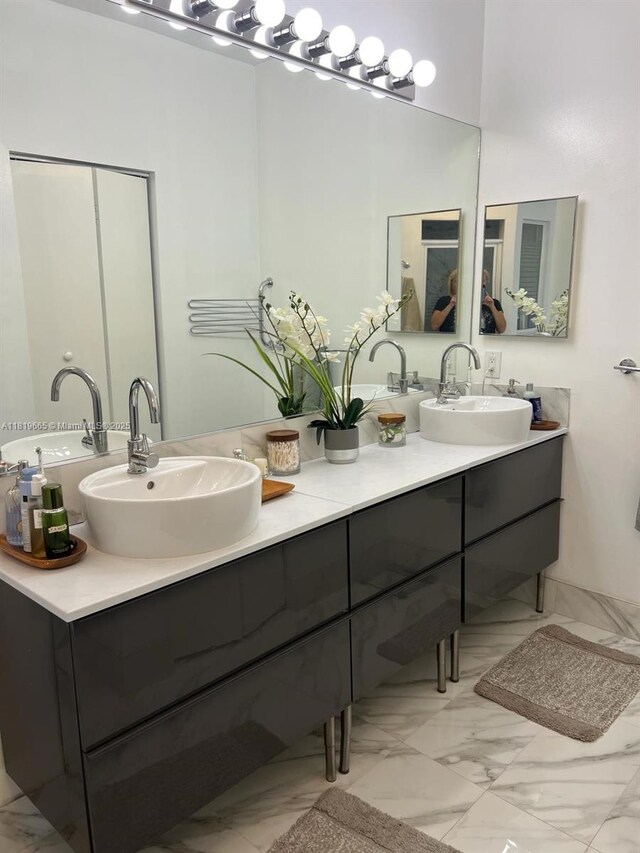 1120 Papaya St, Hollywood, FL 33019 - bathroom featuring marble finish floors and double vanity
