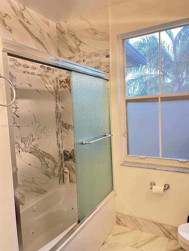 1120 Papaya St, Hollywood, FL 33019 - bathroom with marble look tile flooring, a combined bath / shower with jetted tub, and toilet
