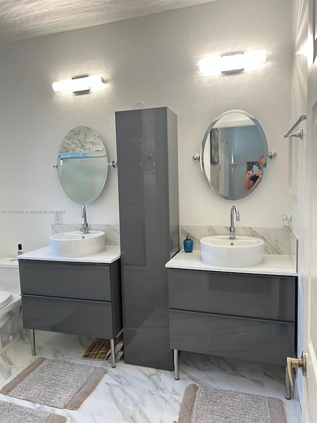 1120 Papaya St, Hollywood, FL 33019 - bathroom with marble finish floors, vanity, and toilet