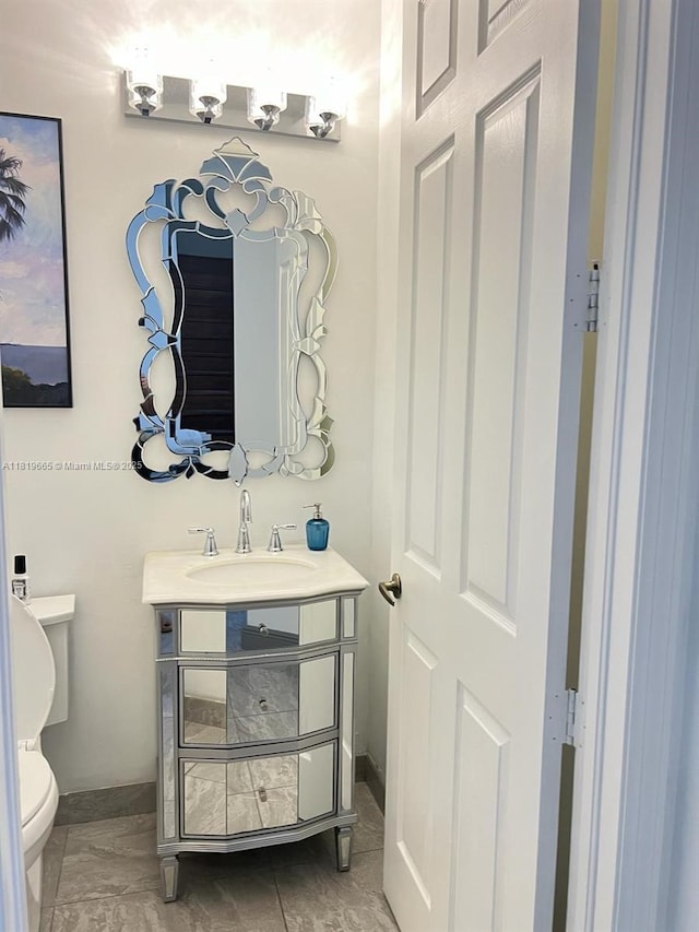 1120 Papaya St, Hollywood, FL 33019 - bathroom featuring vanity, toilet, and baseboards