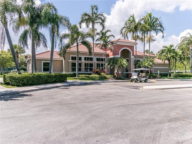 1120 Papaya St, Hollywood, FL 33019 - view of property featuring uncovered parking