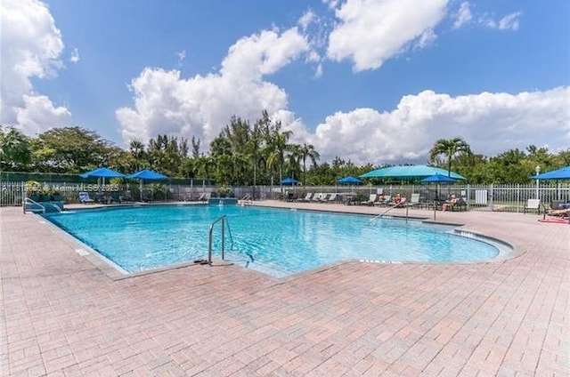 1120 Papaya St, Hollywood, FL 33019 - community pool with a patio area