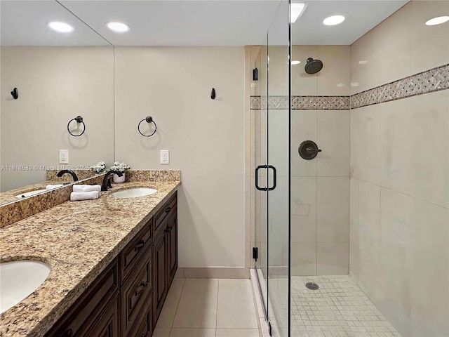 9920 NW 6th Pl Unit 9920, Plantation, FL 33324 - bathroom featuring double vanity, a shower stall, and tile patterned floors