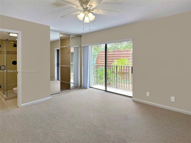9920 NW 6th Pl Unit 9920, Plantation, FL 33324 - unfurnished bedroom featuring access to exterior, carpet floors, a textured ceiling, ensuite bathroom, and a ceiling fan