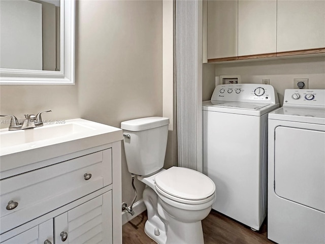 9920 NW 6th Pl Unit 9920, Plantation, FL 33324 - bathroom featuring separate washer and dryer, wood finished floors, and vanity