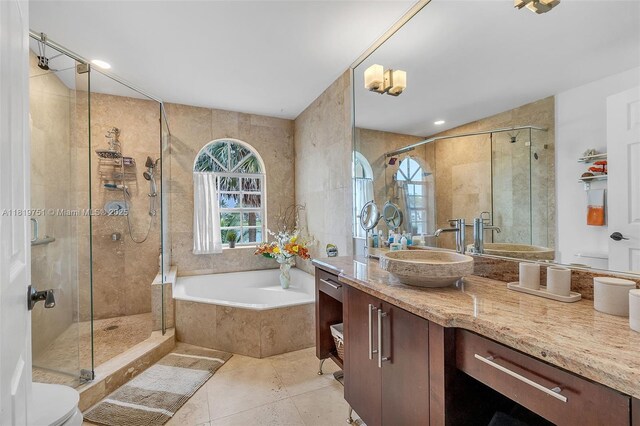 14621 Balgowan Rd Unit 206-3, Miami Lakes, FL 33016 - bathroom featuring a bath, vanity, a shower stall, tile patterned flooring, and tile walls