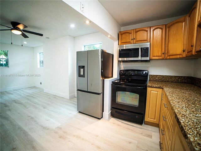 412 Columbus Pkwy, Hollywood, FL 33021 - kitchen with appliances with stainless steel finishes, brown cabinets, light wood-style flooring, plenty of natural light, and recessed lighting