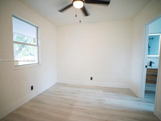 412 Columbus Pkwy, Hollywood, FL 33021 - empty room featuring a ceiling fan, light wood finished floors, and baseboards