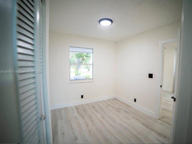 412 Columbus Pkwy, Hollywood, FL 33021 - unfurnished room featuring light wood finished floors and baseboards
