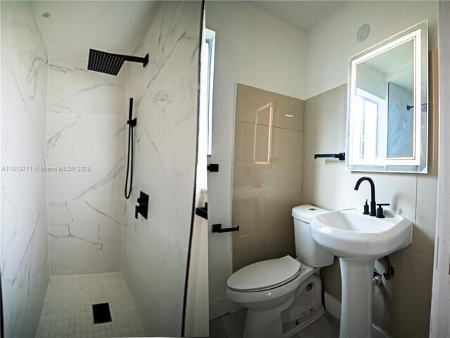 412 Columbus Pkwy, Hollywood, FL 33021 - full bathroom featuring toilet and a marble finish shower