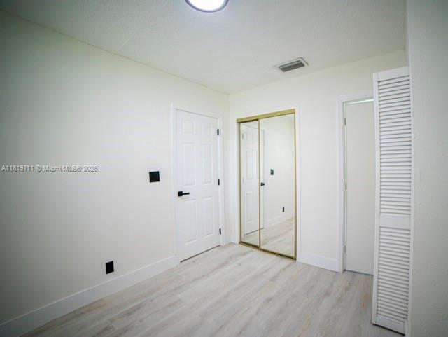 412 Columbus Pkwy, Hollywood, FL 33021 - unfurnished bedroom with light wood finished floors and baseboards