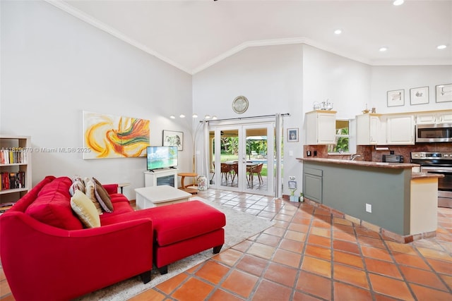 3320 Maple Ln, Davie, FL 33328 - living area with high vaulted ceiling, ornamental molding, recessed lighting, and light tile patterned flooring