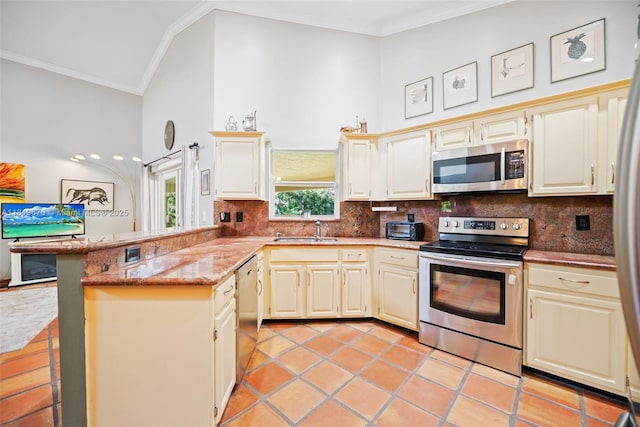 3320 Maple Ln, Davie, FL 33328 - kitchen featuring appliances with stainless steel finishes, ornamental molding, a peninsula, decorative backsplash, and light stone counters