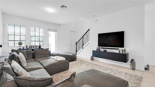 11530 SW 13th Ct, Pembroke Pines, FL 33025 - tiled living room featuring stairway and baseboards