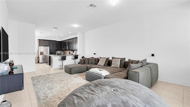 11530 SW 13th Ct, Pembroke Pines, FL 33025 - living room featuring light tile patterned floors, baseboards, and recessed lighting