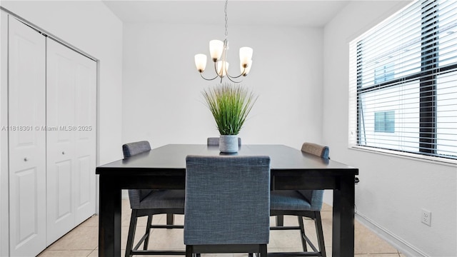 11530 SW 13th Ct, Pembroke Pines, FL 33025 - dining room with light tile patterned floors, a chandelier, and baseboards